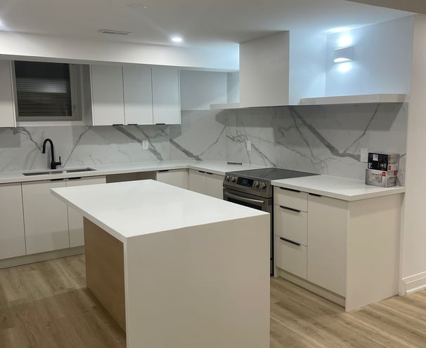 a kitchen with a white counter top and a white counter top