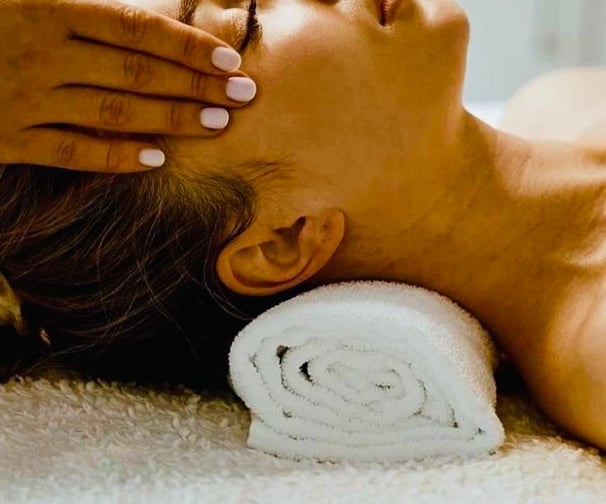 a woman getting a massage at a spa