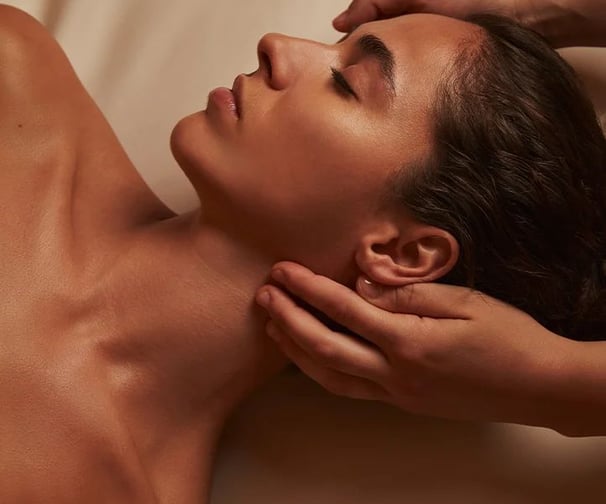 a woman getting a massage at a spa