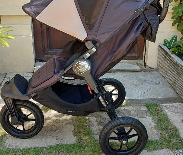 a baby stroller with a baby in a stroller