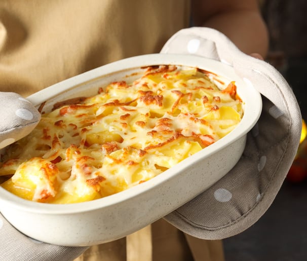Potatoes au Gratin in a white baking dish