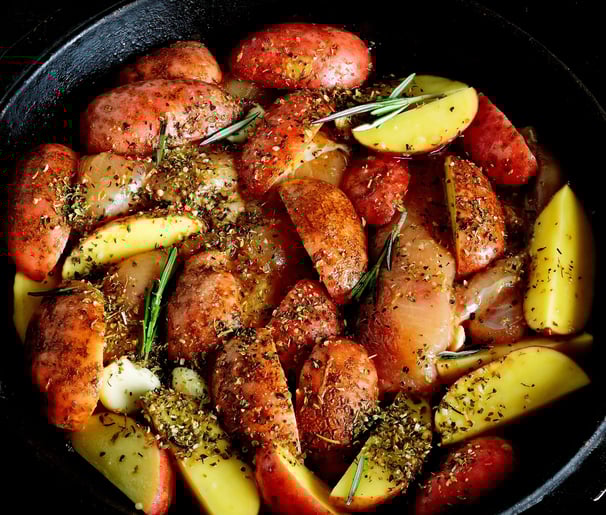 a pan with roasted red potatoes in a skillet