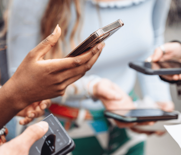 a group of people holding cell phones