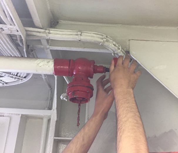 surveying a fire hydrant in a ship