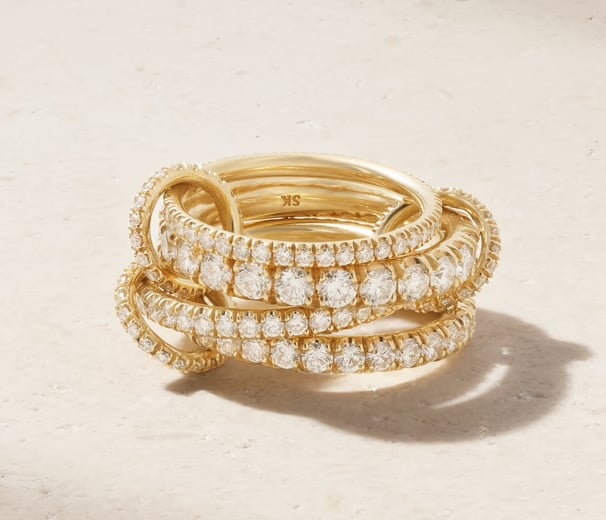 Luxury gold diamond ring with multi-band design, elegant high-end jewelry for timeless style.