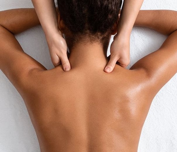 a woman is shown with a man's hands on her back