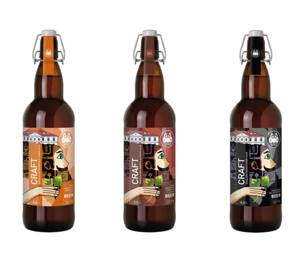 three bottle of craft beer with labels