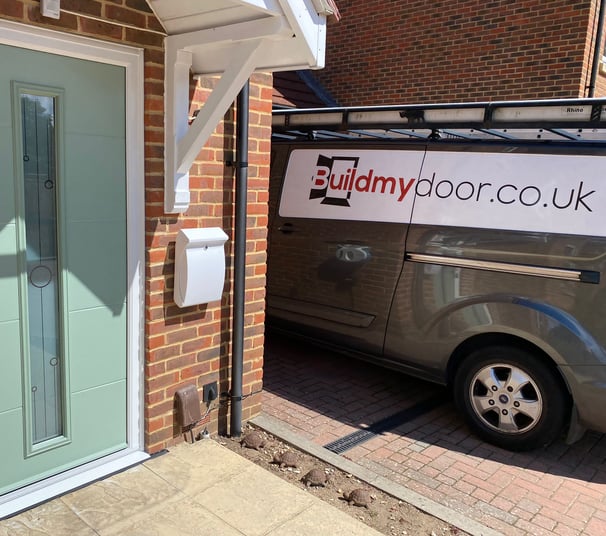 a chart well green front door with long glass panel and the buildmydoor van