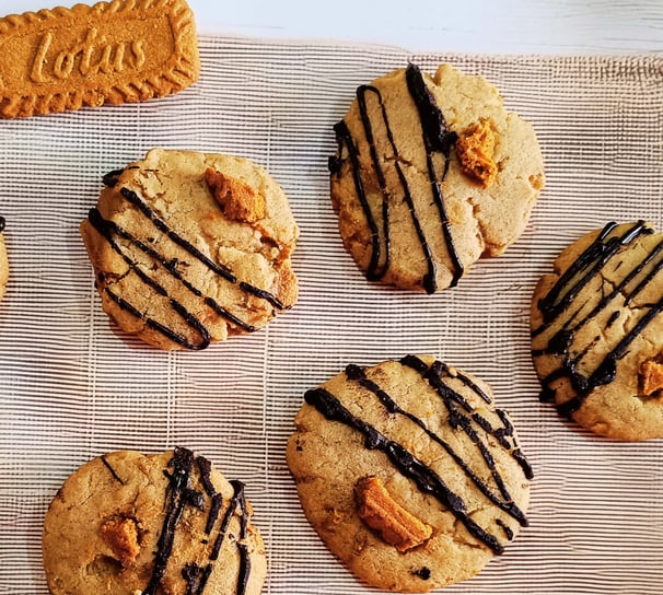 Biscoff-filled cookie styled with crumbs and drizzle