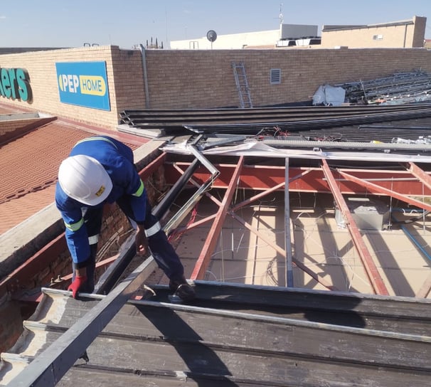 Environmental Pro Construction team replacing a roof structure on a commercial building in West Rand