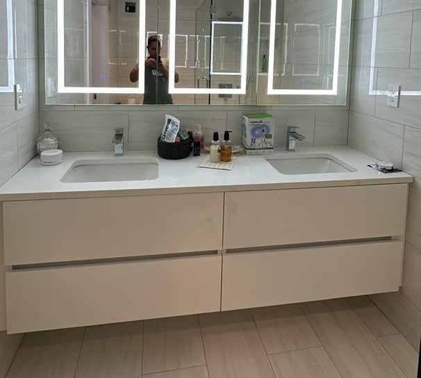 a bathroom with a mirror and a mirror