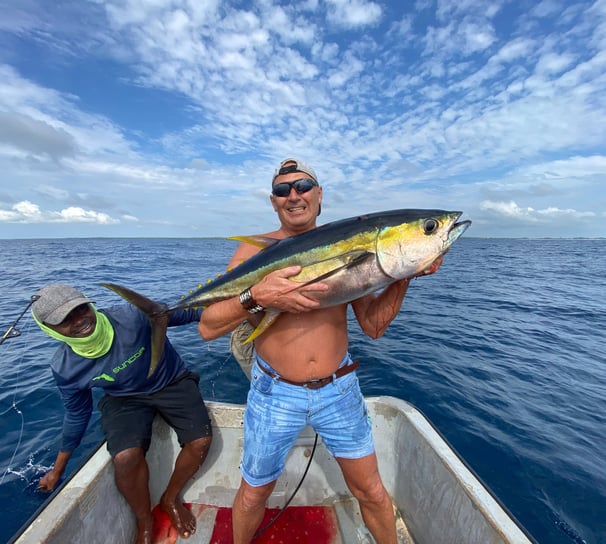 Anglers celebrating a successful yellowfin tuna catch in Makunduchi.