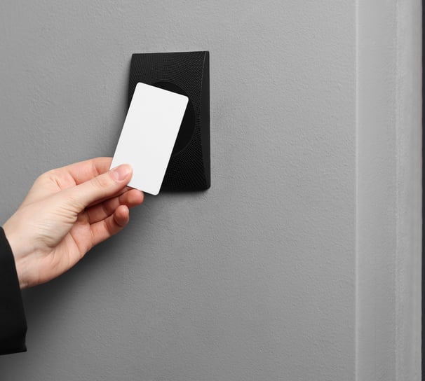 a person holding a business card in their hand