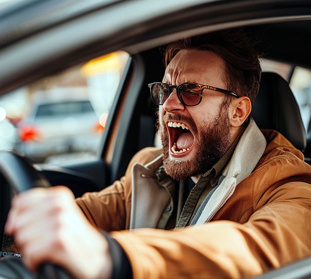 Man having with road rage screaming