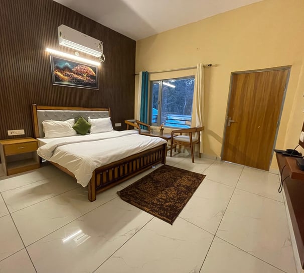 a luxury bedroom with a bed and a television