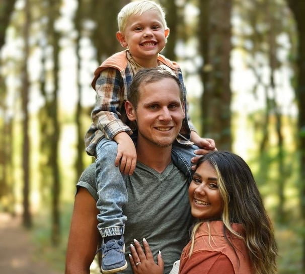 The Woltjer family with beautiful wooded scenery