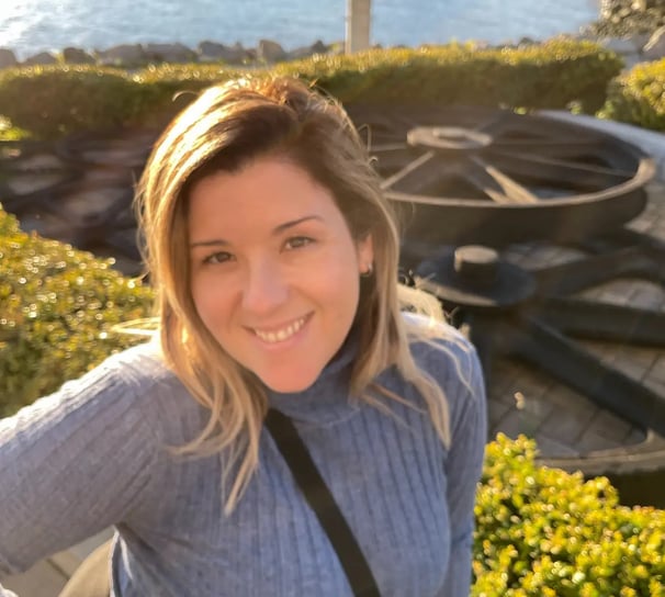 Doula Fabiola in a blue sweater and black pants