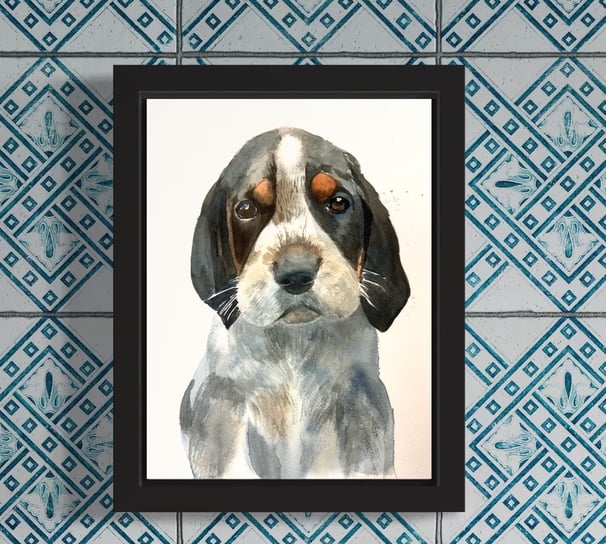 a custom watercolor portrait of a dog in a black frame