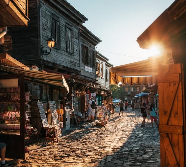 a street scene with a cobblestone road and a cobblestone road