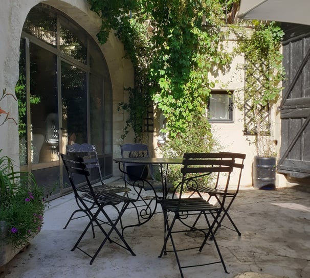 a patio table with chairs and a table