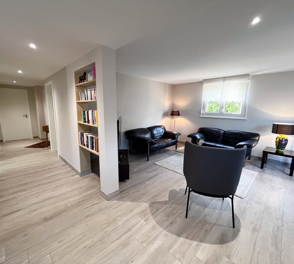 a living room with a couch and a chair
