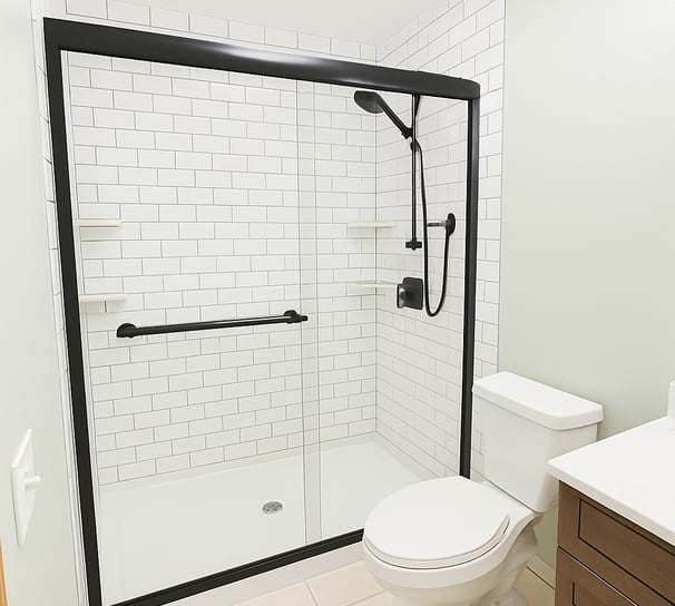 a bathroom with a toilet and a shower