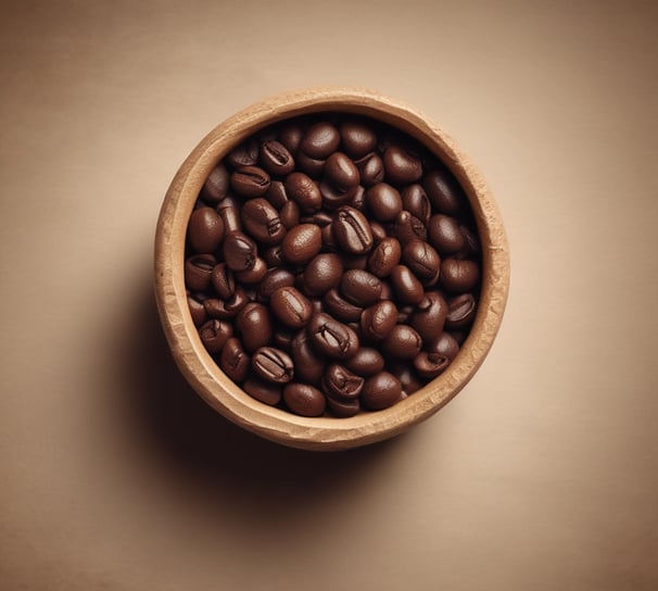 Three brown paper bags of specialty coffee are arranged on a tiled surface. Each bag features a label with a circular design, including the text 'Specialty Coffee' and '100% Pure Arabica'. There is detailed artwork involving a landscape and some text in both English and possibly another language. In the background, a water dispenser is visible.