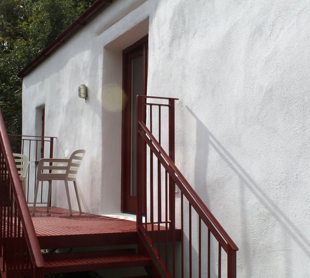 A private balcony with seating