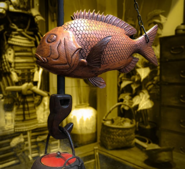 Expert evaluating authenticity of a Japanese piece