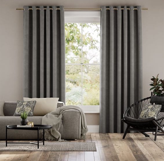 grey curtains with wood flooring