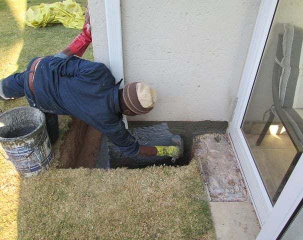 Specialized sealer coat application for foundation layer bricks below ground level to prevent ingress, Randburg