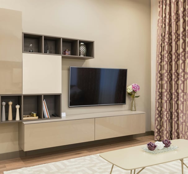 a living room with a television and a couch