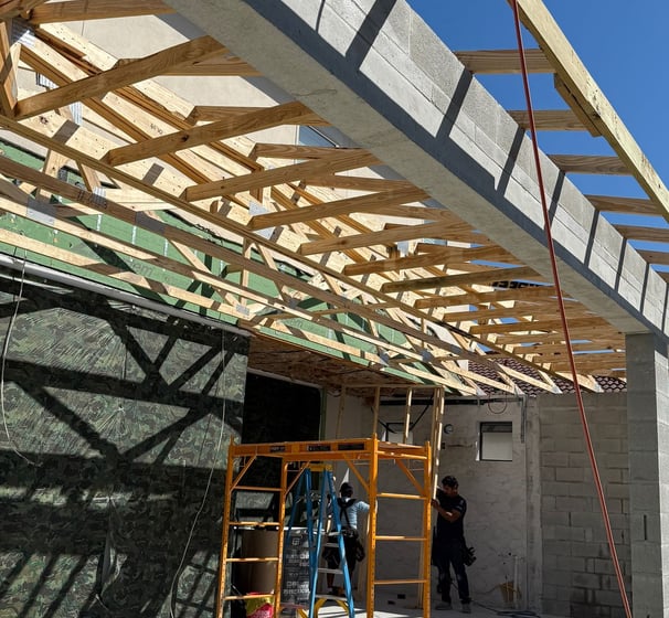 Kissimmee porch remodel showing demolition phase — existing structure cleared for full reconstructio