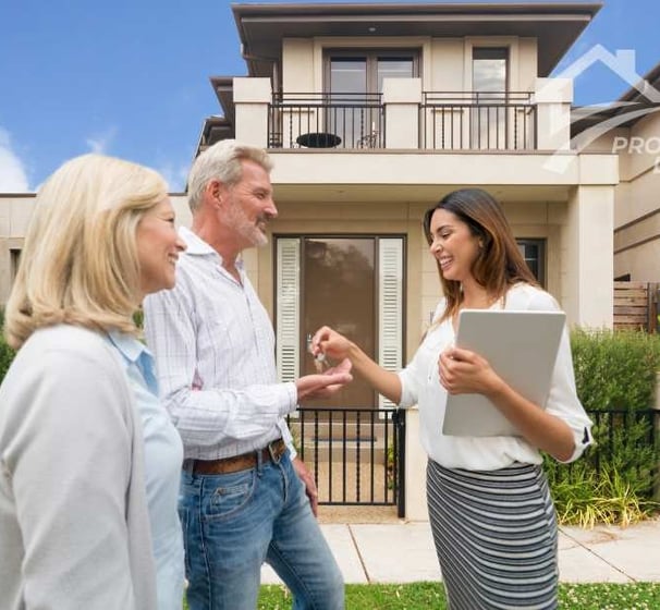 a couple and their family standing in front of a house
