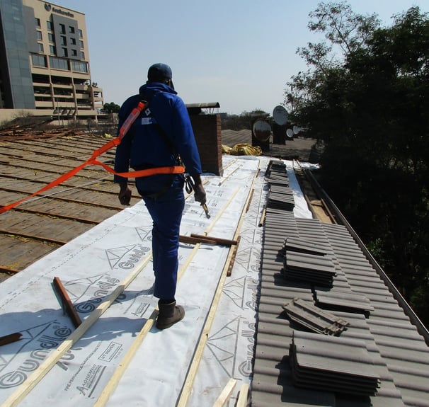 Staff safety harnessed to harness line, safety first, Hyde Park, Sandton