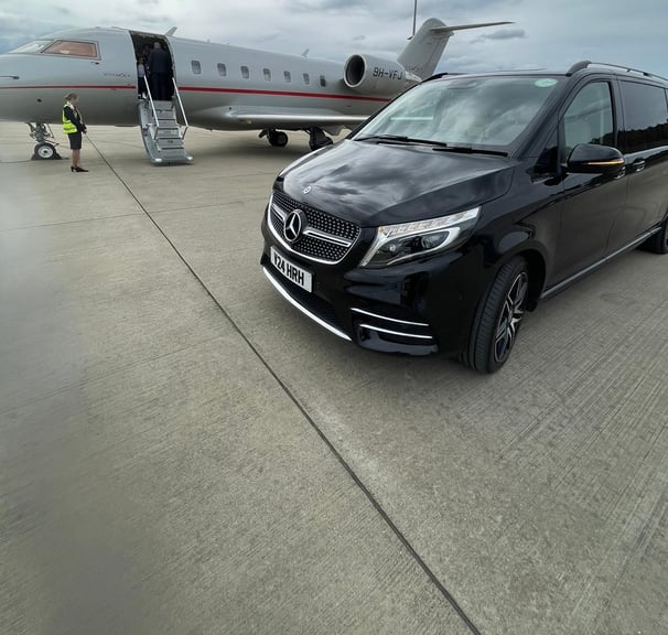 Private Jet Transfers. Mercedes V Class next to Vista Jet | Smart City Prestige