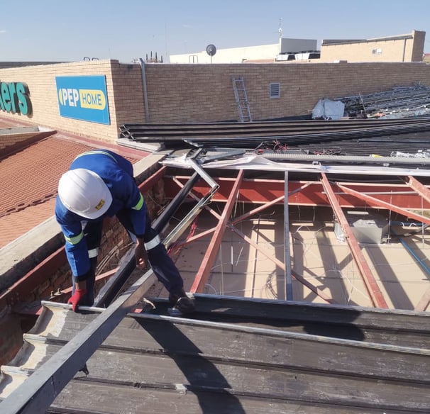 Environmental Pro Construction team replacing a roof structure on a commercial building in West Rand