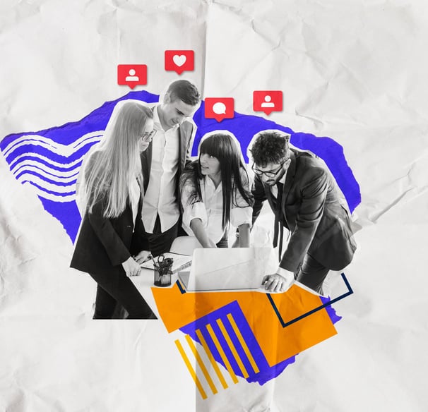 a group of people standing around a laptop