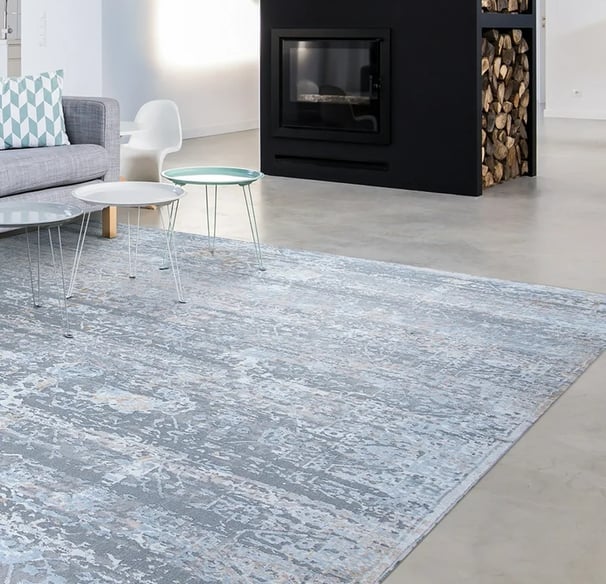 blue rug with a black fireplace