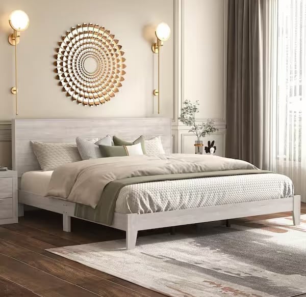 gold wall sconces with grey bed frame and gold accent hanging