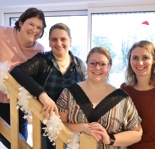 a group of people standing on a staircase case