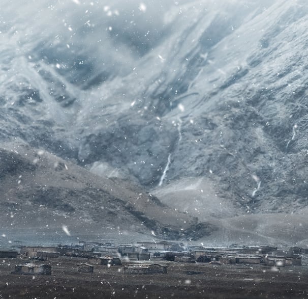 a train traveling through a snowy mountain range