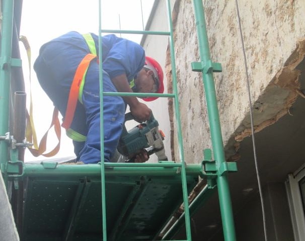 Mechanical stripping of compromised exterior plaster for waterproofing works, Sandhurst Towers, Sandton