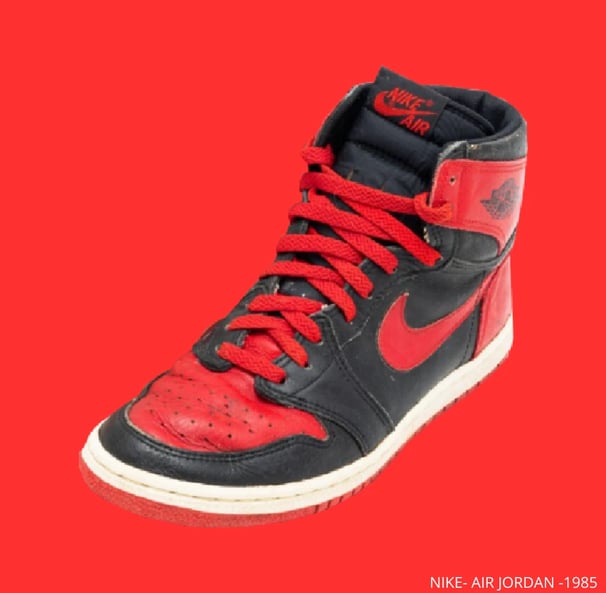 a pair of shoes with red and black sneaker, Air Jordan 1 - 1985
