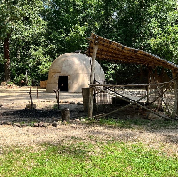 a dome shaped structure with a wooden structure