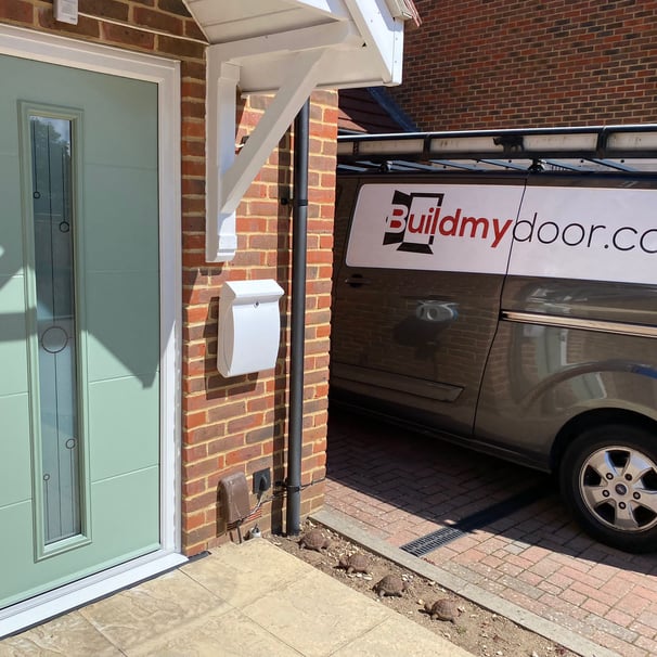 a chart well green front door with long glass panel and the buildmydoor van