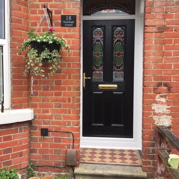 new black front door with bespoke glass which was fitted in Woolston, Southampton by Buildmydoor