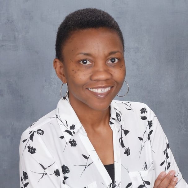 Photo of Michelle Wright in white blouse with black floral print