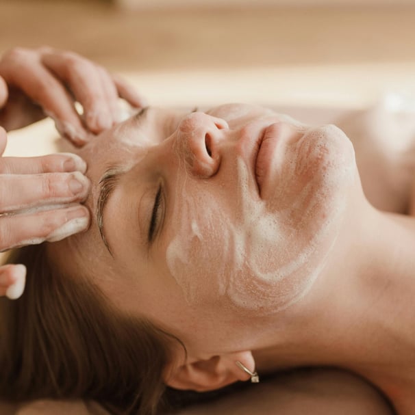 women with a facial application