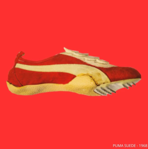 a pair of shoes with a red and white stripe,  First Puma Suede 1968